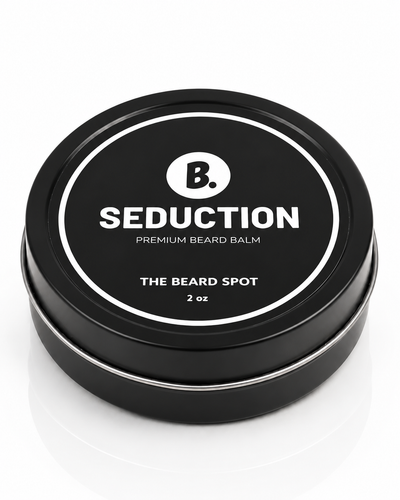 The Beard Spot Seduction Premium Beard Balm, 2 oz closed black metal tin on a clean studio background.