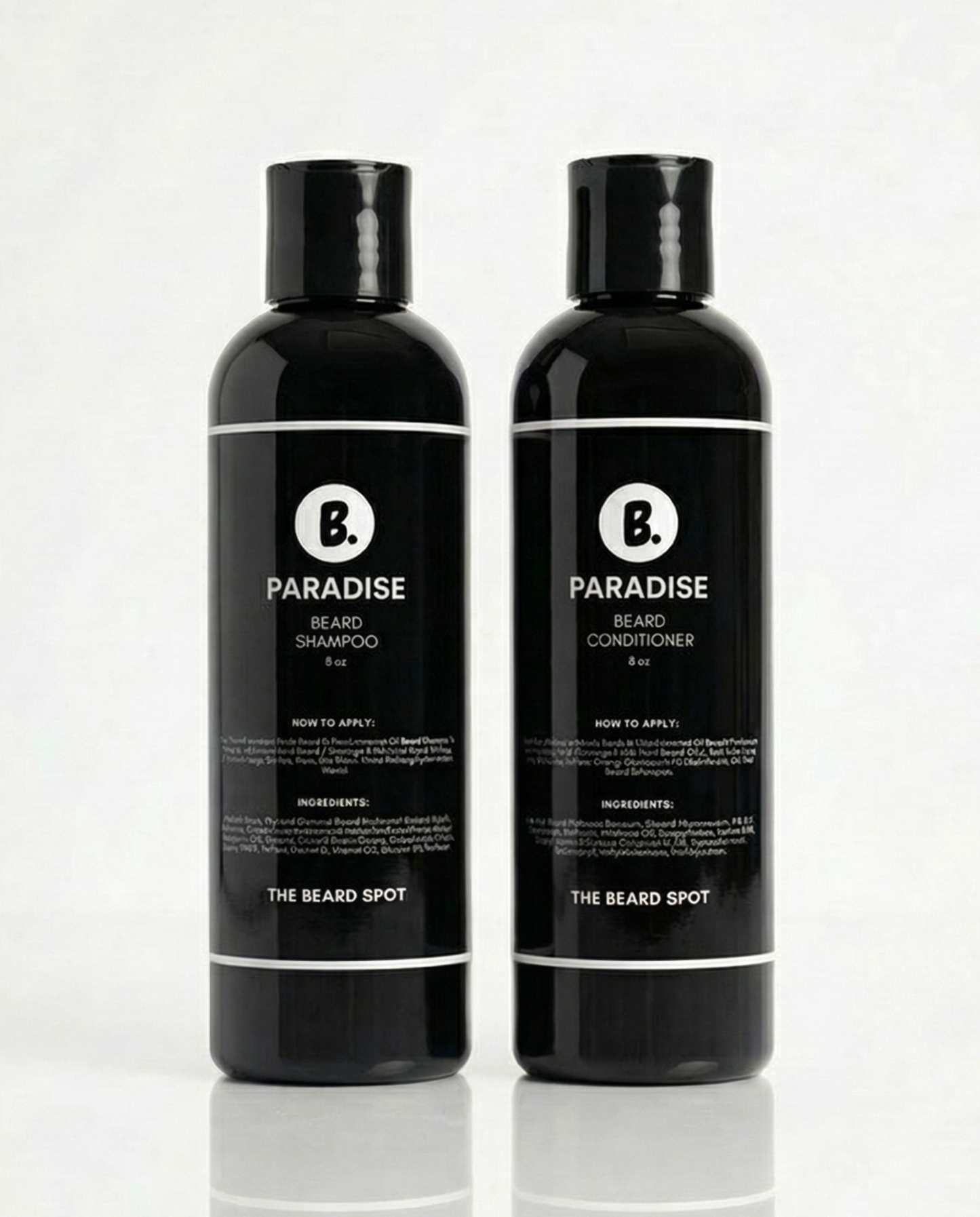 Two black bottles of 'Paradise' beard care products on a white background